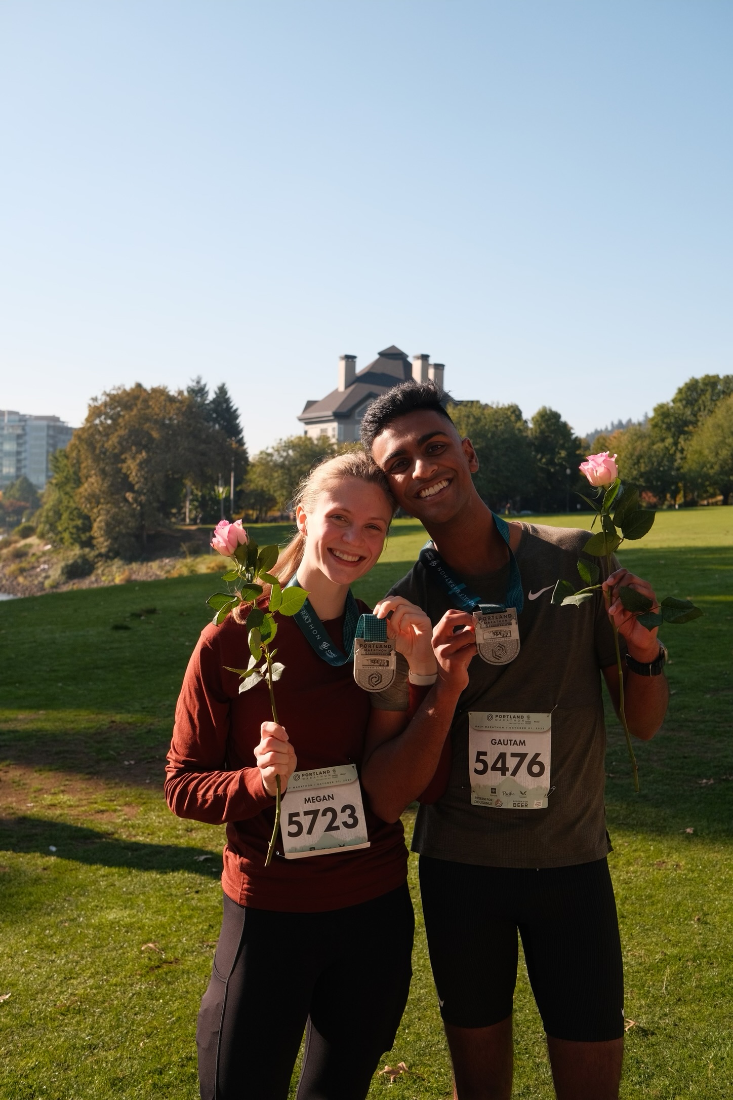 Megan and Gautam at the finish of the PDX Half Marathon
